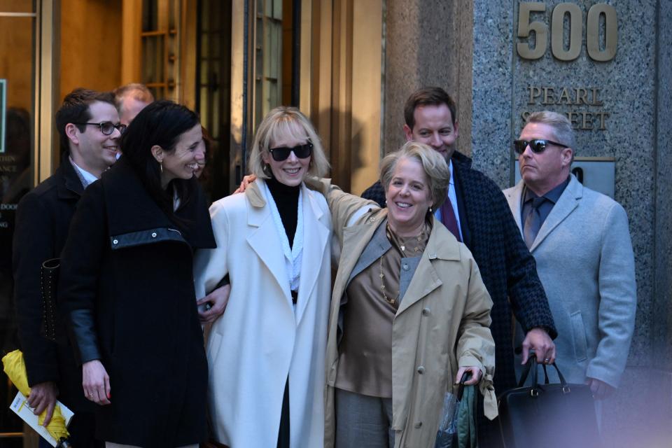 Writer E. Jean Carroll (C) leaves federal court after the verdict in her defamation case against former US president Donald Trump