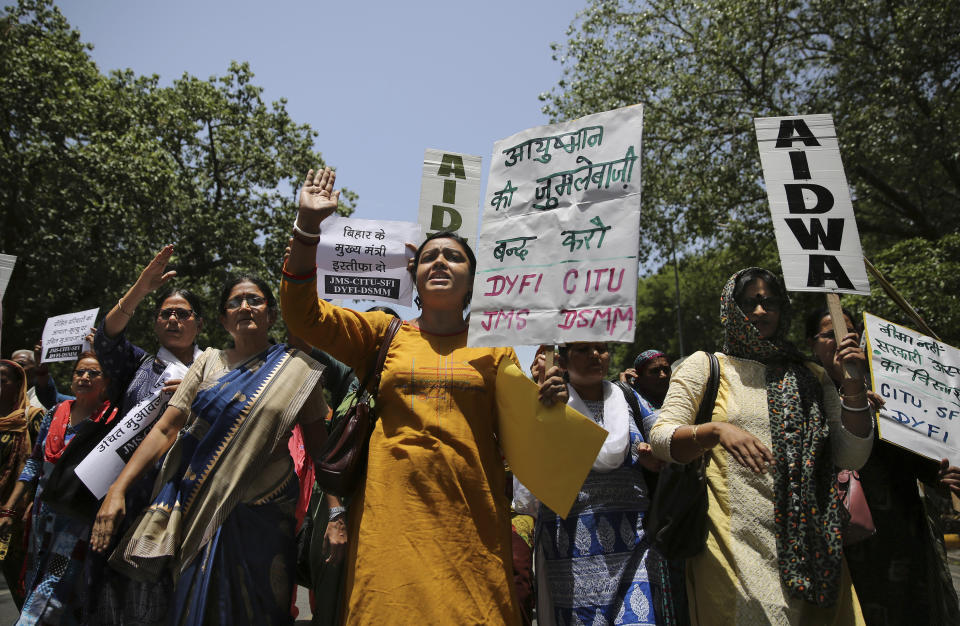 Left wing activists shout slogans as they protest against deaths of more than 100 children due to Encephalitis in the Indian state of Bihar, in New Delhi, India, Tuesday, June 18, 2019. (AP Photo/Altaf Qadri)