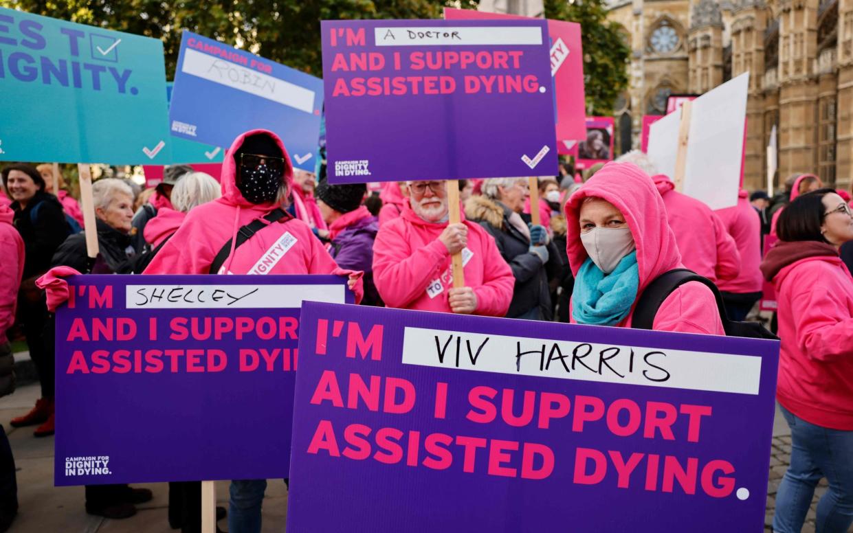 Demonstrators during a debate on assisted dying in Parliament in 2021