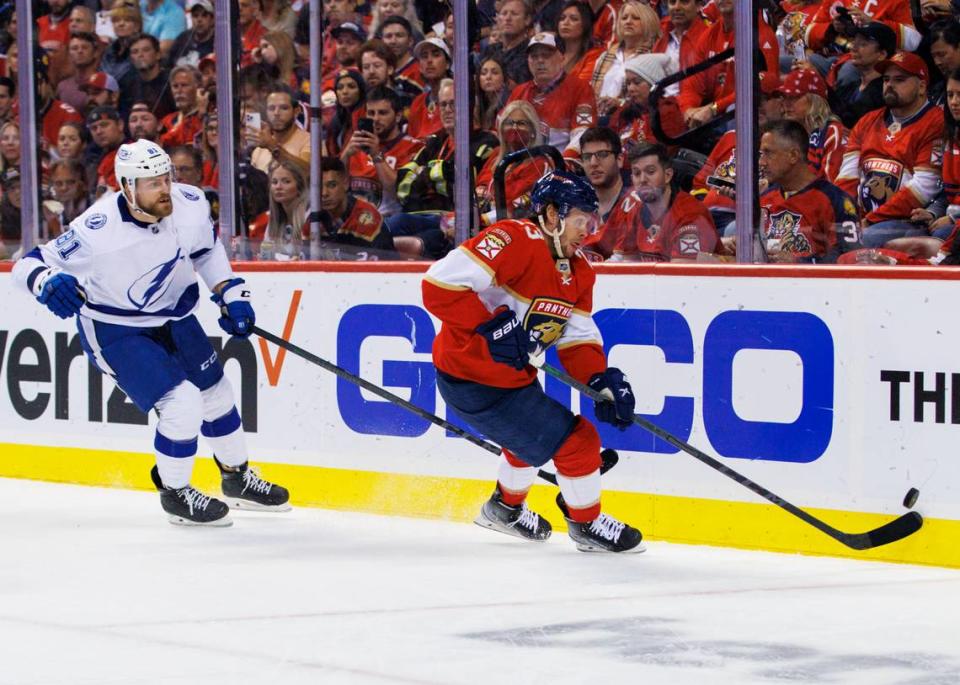 Florida Panthers center Carter Verhaeghe (23) chases down the puck against Tampa Bay Lightning defenseman Erik Cernak (81) during the first period of Game 1 of a second round NHL Stanley Cup series at FLA Live Arena on Tuesday, May 17, 2022 in Sunrise, Fl.