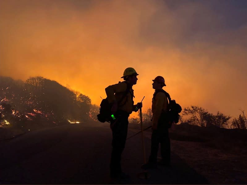 Firefighters battle the Cave fire in Los Padres National Forest near East Camino Cielo