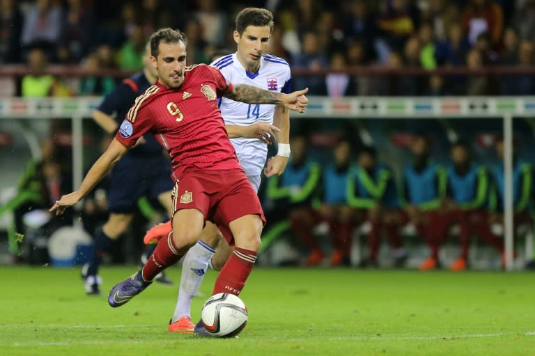 Spain's Paco Alcacer (L) scores a goal during their Euro 2016 qualifying match against Luxembourg, at Las Gaunas stadium in Logrono, on October 9, 2015