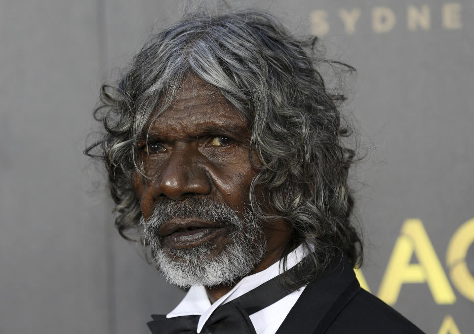 David Gulpilil poses on the red carpet at the 2015 AFI AACTA Awards at the Star in Sydney, Thursday, Jan. 29, 2015. Gulpilil has died of lung cancer, a government leader said on Monday, Nov. 29, 2021. He was 68 years old. (Nikki Short/AAP Image via AP)