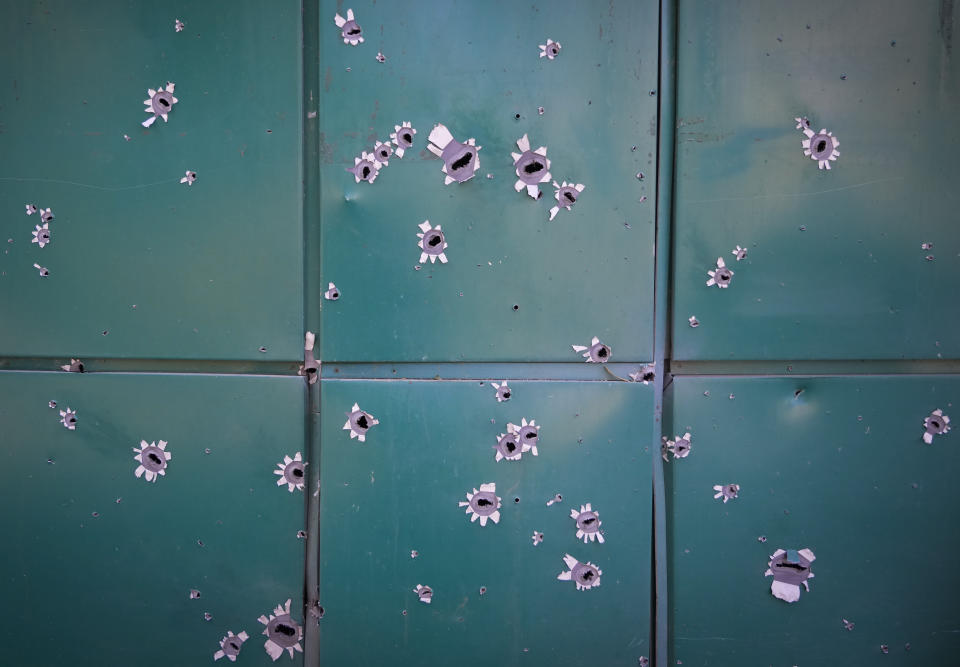 Shrapnel traces on a house damaged by Russian night shelling in the town of Bakhmut, Donetsk region, Ukraine, Monday, June 13, 2022. (AP Photo/Efrem Lukatsky)