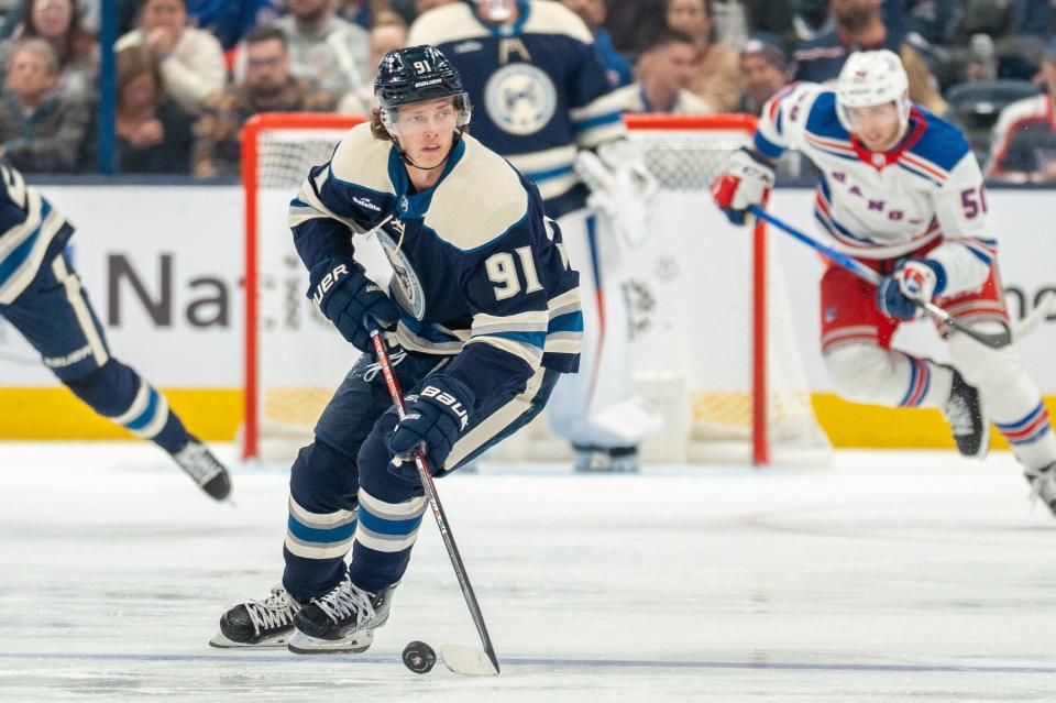 Oct 14, 2023; Columbus, Ohio, United States;
Columbus Blue Jackets center Kent Johnson (91) looks for an open pass during the third period their game against the New York Rangers on Saturday, Oct. 14, 2023 at Nationwide Arena.