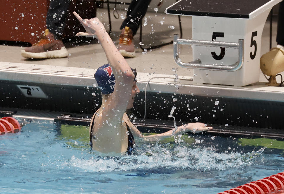 Pennsylvania's Lia Thomas, celebrates after winning the 100-yard freestyle final at the Ivy League women's swimming and diving championships at Harvard University, Saturday, Feb. 19, 2022, in Cambridge, Mass. Thomas, who is transitioning to female, is swimming for the Penn women's team. (AP Photo/Mary Schwalm)