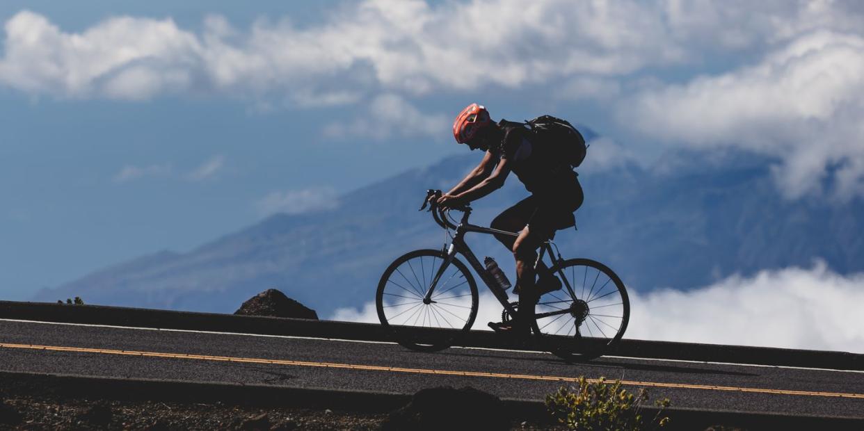 cyclist going up a climb in hawaii