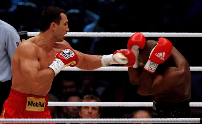   Wladimir Klitschko (L) Of Ukraine Punches Bongarts/Getty Images