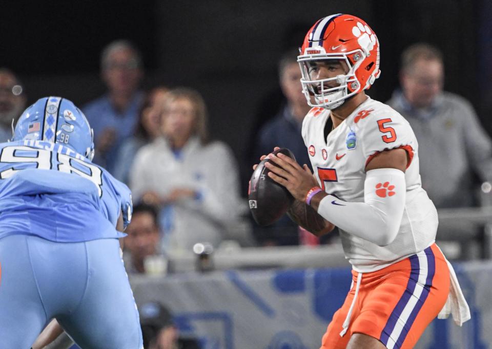 Clemson quarterback DJ Uiagalelei (5) fades back to pass near North Carolina defensive lineman Kevin Hester (98) during the first quarter of the ACC Championship football game at Bank of America Stadium in Charlotte, North Carolina Saturday, Dec 3, 2022.   