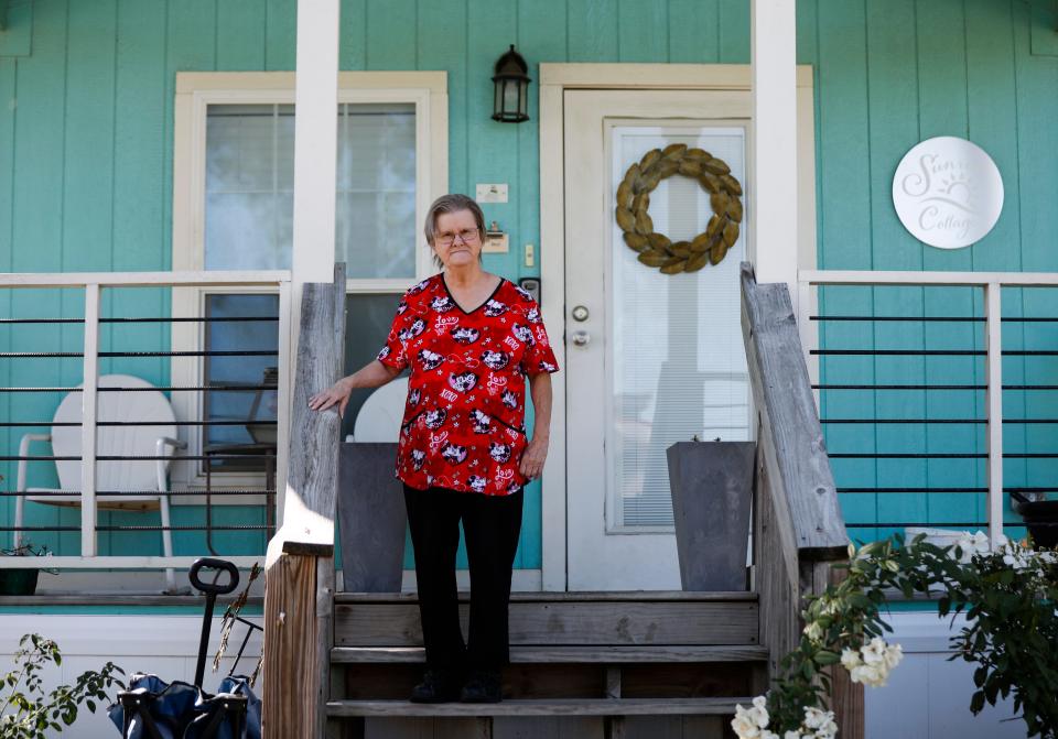 Nancy Lawrence on the front porch of her house at Eden Village on Monday, Sept. 26, 2022. Lawrence was one of the first residents to move into a home at Eden Village I on East Division Street nearly four years ago when it opened.