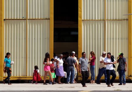 Relatives of the 43 missing students of the Ayotzinapa teachers' training college leave a hangar after a meeting with Mexico's Attorney General Jesus Murillo Karam at an airstrip of Mexico's Federal Police in Chilpancingo November 7, 2014. REUTERS/Daniel Becerril