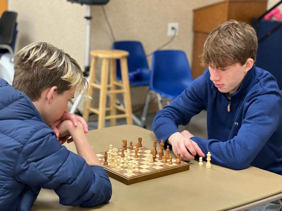 Ramsey Stiles, far right, plans his move against his opponent, Murphy Stiles, during a match at Gaston Chess, which meets 6:30 p.m. Tuesdays at Gaston County Senior Center in Dallas.