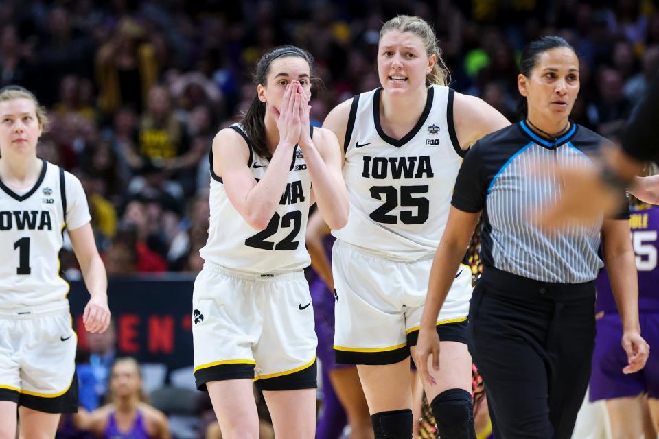 Apr 2, 2023; Dallas, TX, USA; Iowa Hawkeyes guard Caitlin Clark (22) reacts alongside forward Monika Czinano (25) during a stop in play against the LSU Lady Tigers in the second half during the final round of the Women's Final Four NCAA tournament at the American Airlines Center. Mandatory Credit: Kevin Jairaj-USA TODAY Sports