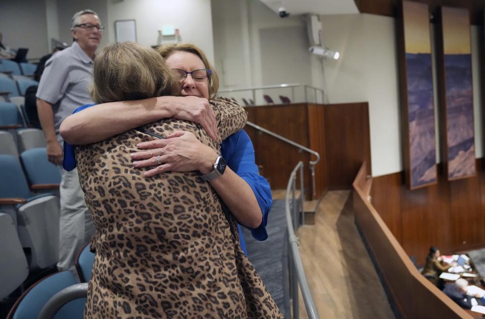 Cathy McDavid (left) hugs Dana Kennedy, Arizona director of AARP, after members of the Arizona House voted to pass House Bill 2764, a long-awaited assisted living care bill, on April 4, 2024.
