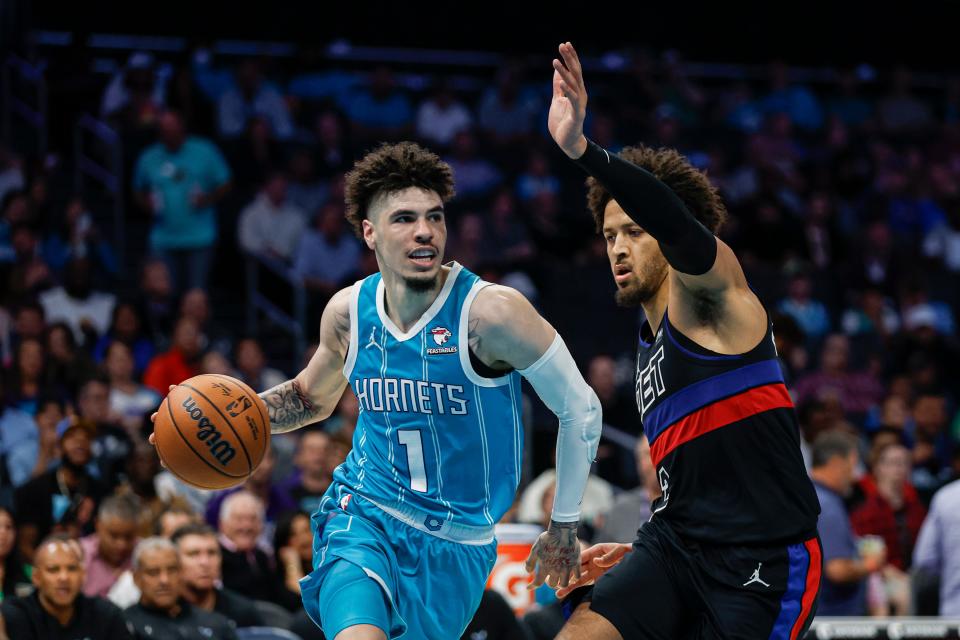 Charlotte Hornets guard LaMelo Ball (1) drives against Detroit Pistons guard Cade Cunningham, right, in the second half at the Spectrum Center in Charlotte, North Carolina, on Friday, Oct. 27, 2023.