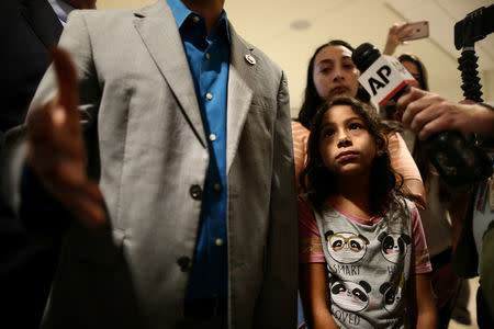 Estela Juarez, 9, daughter of Alejandra Juarez, looks on as U.S. Rep. Darren Soto (D-FL) speaks to reporters at the Orlando International Airport before the deportation of Alejandra Juarez, who has lived in Soto’s district for years, in Orlando, Florida, U.S., August 3, 2018. REUTERS/Joey Roulette