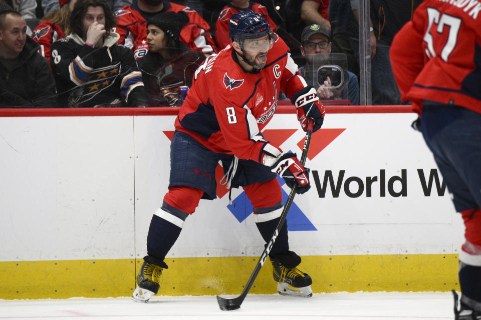 Washington Capitals left wing Alex Ovechkin (8) works with the puck during the second period of the team's NHL hockey game against the Pittsburgh Penguins, Thursday, Jan. 26, 2023, in Washington. (AP Photo/Nick Wass)