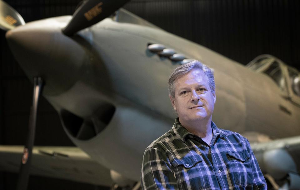 Hunter Chaney photographed with the Curtiss P-40B Tomahawk at the American Heritage Museum in Hudson.