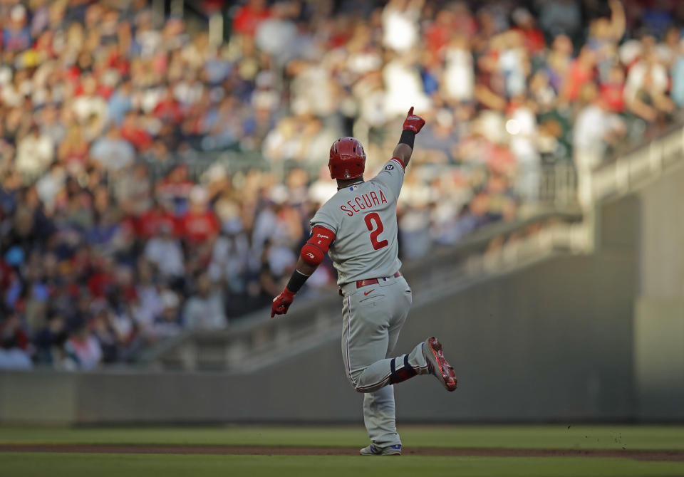 Philadelphia Phillies' Jean Segura celebrates after hitting a home run off Atlanta Braves pitcher Ian Anderson in the first inning of a baseball game Saturday, May 8, 2021, in Atlanta. (AP Photo/Ben Margot)