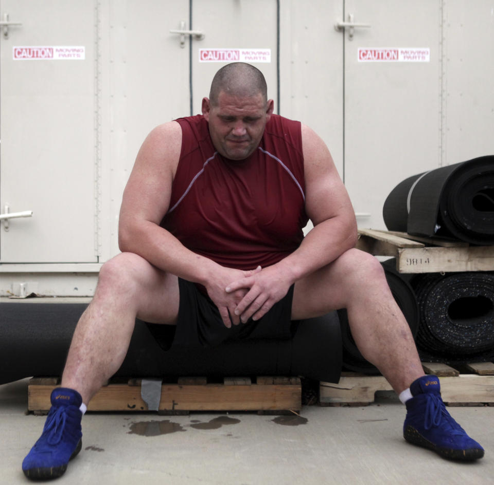 FILE - In this July 14, 2011, file photo, Rulon Gardner takes a breather while training in Colorado Springs, Colo., for a comeback at the 2012 Olympic Games in London. An Olympic Channel documentary debuting Wednesday, July 22, 2020, chronicles the highs and lows of Rulon Gardner in the 20 years since his stunning gold-medal victory in the 2000 Olympics. (Genna Ord/The Gazette via AP)