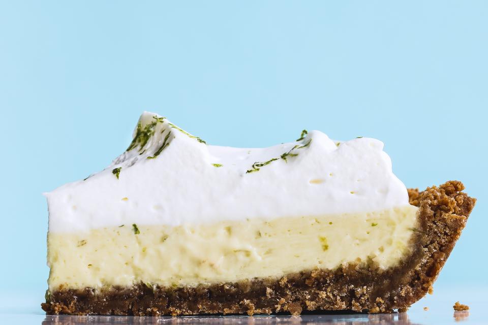 Using coconut oil in place of some of the butter suggests hints of the tropics, and yogurt folded into the whipped cream reinforces the tang of the lime juice. This key lime pie recipe is part of BA's Best, a collection of our essential recipes.