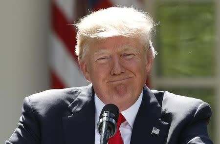 U.S. President Donald Trump pauses as he announces his decision that the United States will withdraw from the landmark Paris Climate Agreement, in the Rose Garden of the White House in Washington, U.S., June 1, 2017. REUTERS/Kevin Lamarque/Files