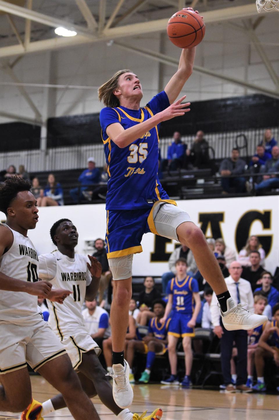 Wolfforth Frenship's Tate Beeles (35) goes up for a dunk during Tuesday's game against Abilene High. Beeles scored a game-high 35 points as the Tigers ran away with the 99-59 victory.