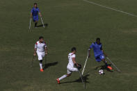 Palestinian amputees compete in a soccer match while using their crutches during a training session, organized by the International Committee of the Red Cross with the Palestinian Amputee Football Association, at Palestine Stadium in Gaza City, Sunday, Dec. 5, 2021. They are the first Palestinian national soccer team made up entirely of amputees — players drawn from a population of hundreds that has grown in recent years through several rounds of fighting between Israel and the territory's militant Hamas rulers. (AP Photo/Adel Hana)