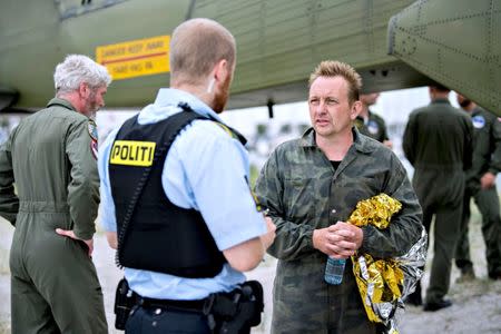 Danish submarine owner and inventor Peter Madsen lands with the help of the Danish defence in Dragor Harbor south of Copenhagen, Denmark August 11, 2017. Scanpix Denmark/Bax Lindhardt/via REUTERS