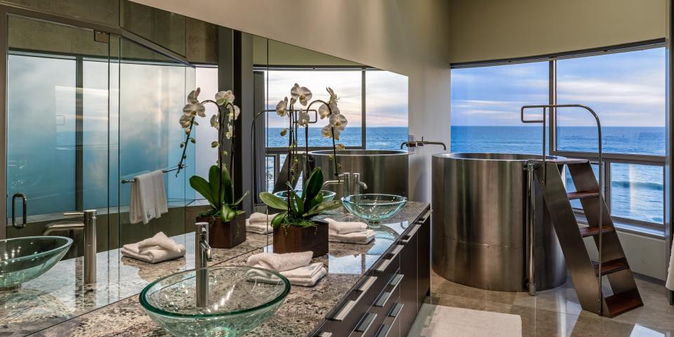 A bathroom with a sea view.