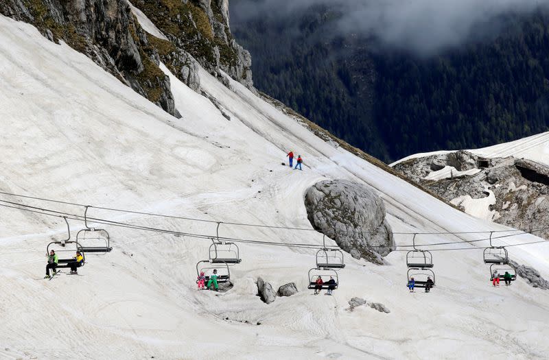 People ski on the slopes of Kanin after the Slovenian government called an official end to the country's coronavirus disease (COVID-19) outbreak, in Kanin