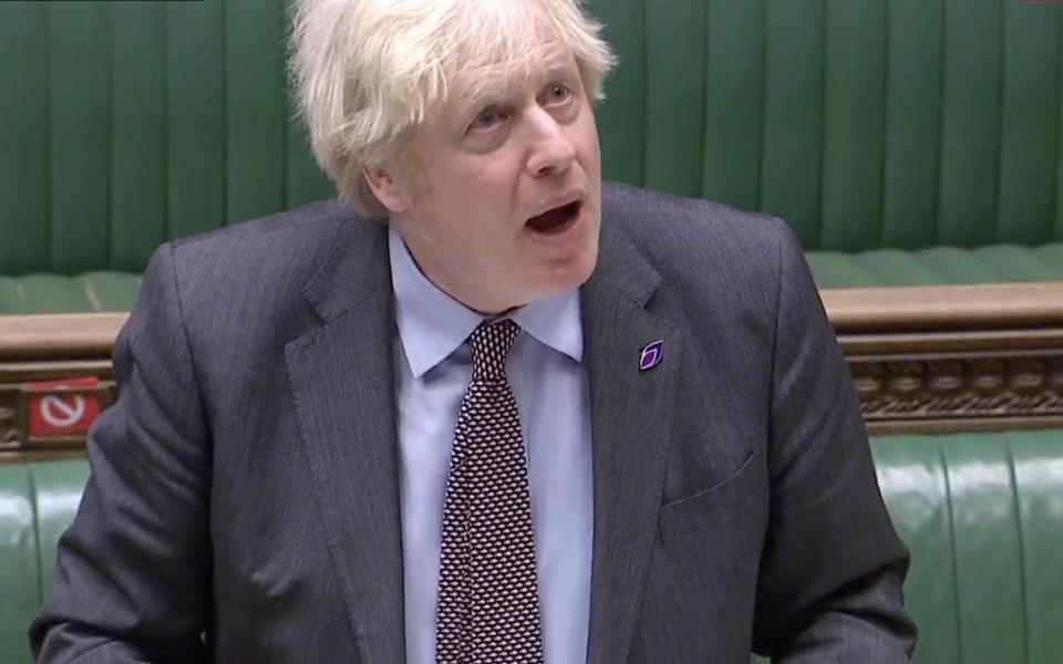 Boris Johnson talks during PMQs