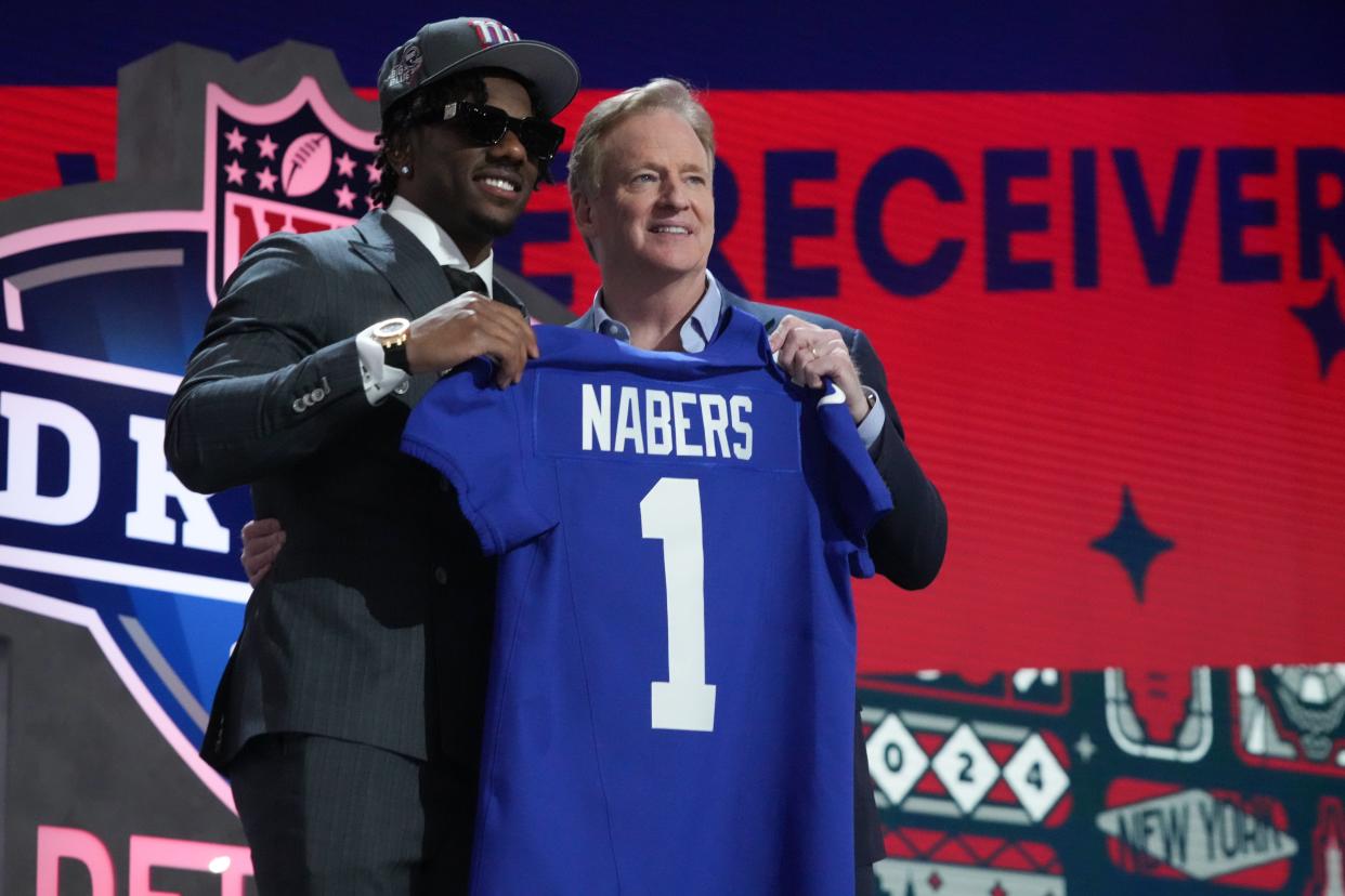 Apr 25, 2024; Detroit, MI, USA; LSU Tigers wide receiver Malik Nabers poses with NFL commissioner Roger Goodell after being selected by the New York Giants as the No. 6 pick in the first round of the 2024 NFL Draft at Campus Martius Park and Hart Plaza. Mandatory Credit: Kirby Lee-USA TODAY Sports