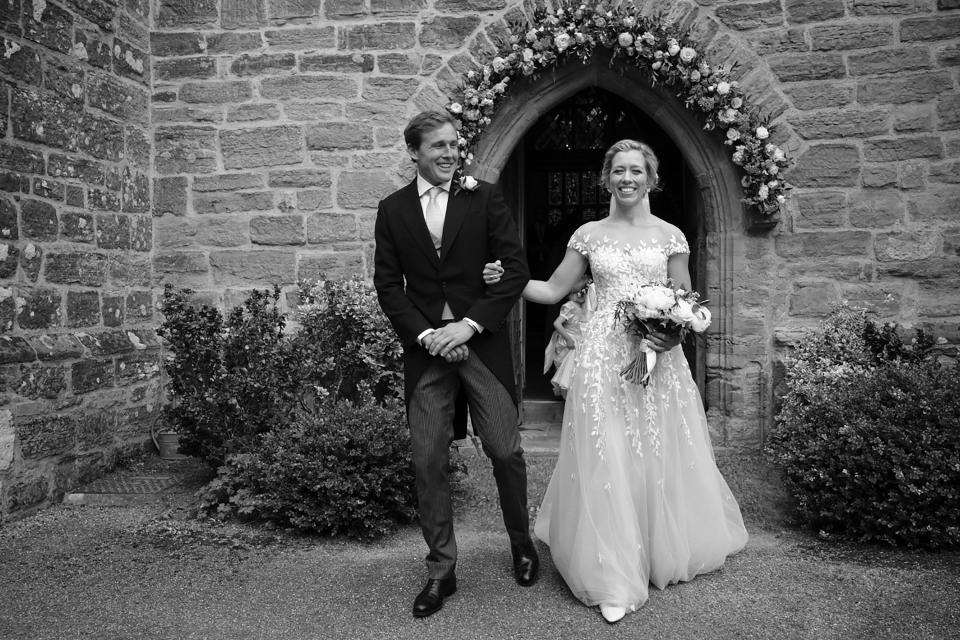 We were both beaming with joy as we left the church through the flower arch to the bells pealing out.