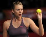 Russian tennis player Maria Sharapova serves a ball to Serbian Ana Ivanovic during an exhibition match in Bogota, Colombia, on December 6, 2013. She is a United Nations Development Programme (UNDP) Goodwill Ambassador.