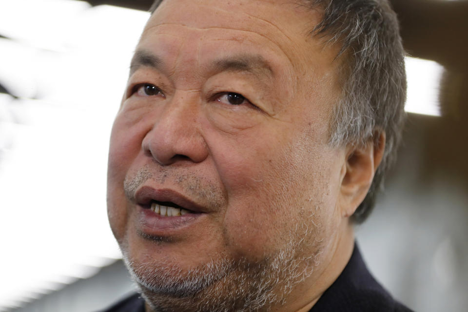 Dissident Chinese artist Ai Weiwei speaks to journalists during a press preview of his new exhibition "Rapture" in Lisbon, Thursday, June 3, 2021. The world-renowned artist is putting on the biggest show of his career, and he is doing it in a place he's fallen in love with: Portugal. (AP Photo/Armando Franca)