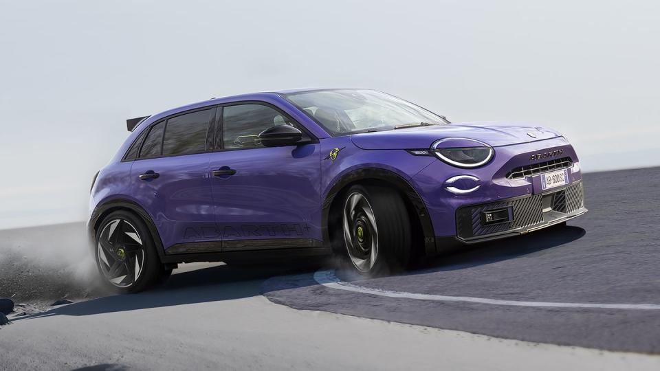 abarth 600e driving on a track