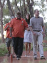 Britain's Prince William, right, and his wife Kate, the Duchess of Cambridge, are guided by Sammy Wilson along the Kuniya walk at Uluru, Australia, Tuesday, April 22, 2014. The couple is on a three-week visit to Australia and New Zealand. (AP Photo/Rob Griffith, Pool)