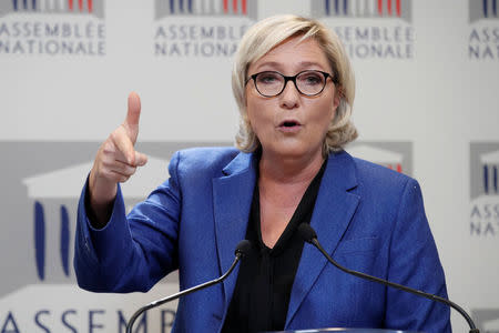 Marine Le Pen, member of parliament and head of France's far-right National Front (FN) political party, attends a news conference on the state of emergency bill ahead of the extraordinary parliamentary session opening in Paris, France, September 25, 2017. REUTERS/Benoit Tessier