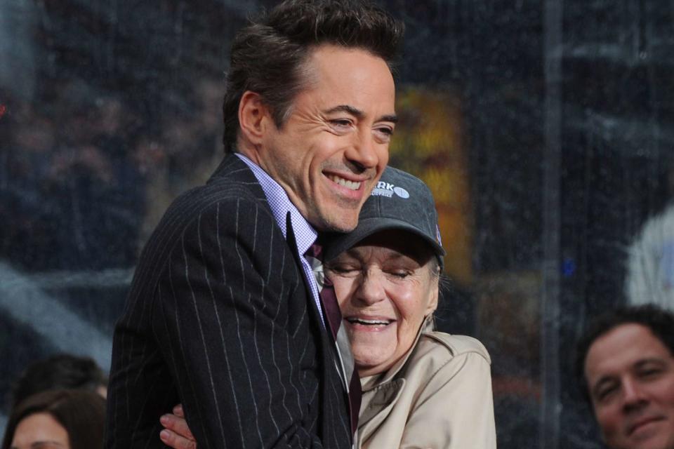 <p>Jim Ruymen/UPI/Shutterstock</p> Robert Downey Jr. hugs his mother Elsie while being honored during a hand and footprint ceremony at Grauman