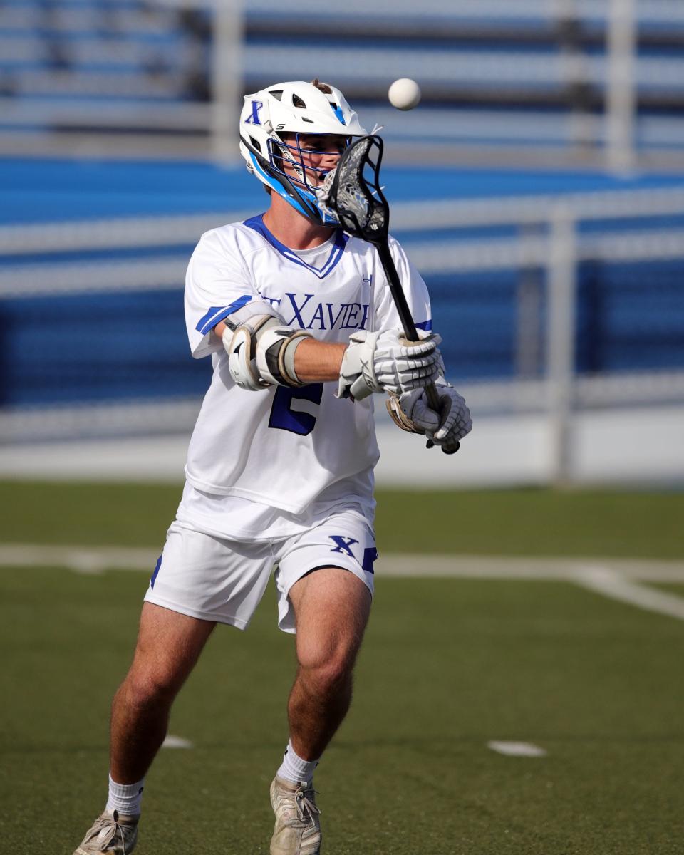 Saint Xavier's Andrew Andsager makes a pass against Springboro in the Division I regional championship game at Saint Xavier May 27, 2022.