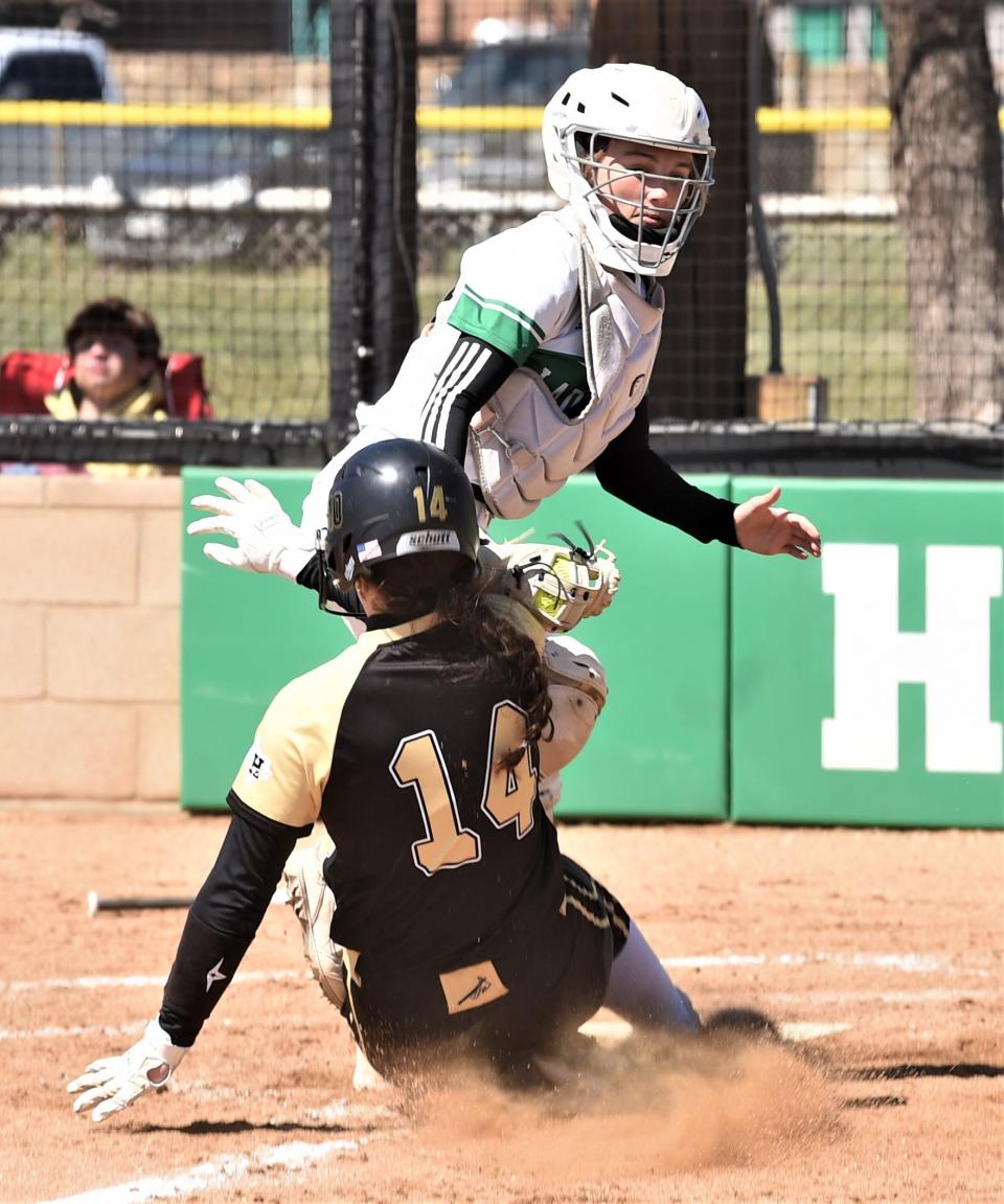 Hamlin catcher Emalee Duniven tags out Haskell's Alyssa Stocks at home plate. Duniven had snagged a high throw home and came down in time to catch Stocks, who was trying to score when Mia Williams reached on a one-out error on a dropped ball in the outfield.