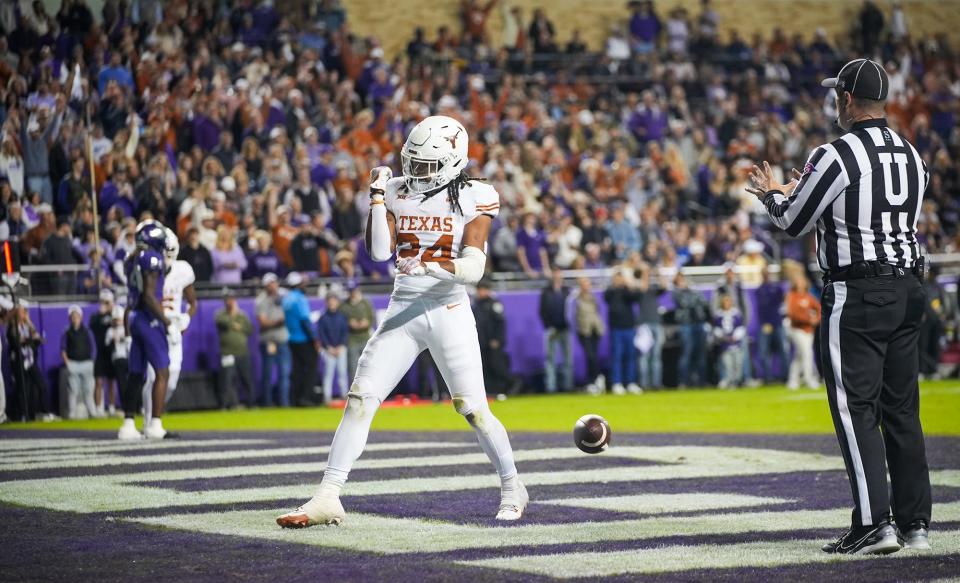 Texas running back Jonathon Brooks celebrates after a first-quarter touchdown against TCU on Nov. 11 at Amon G. Carter Stadium in Fort Worth. But he was lost for the season later in the game after suffering a torn ACL. Now he waits to find out his NFL draft fate.