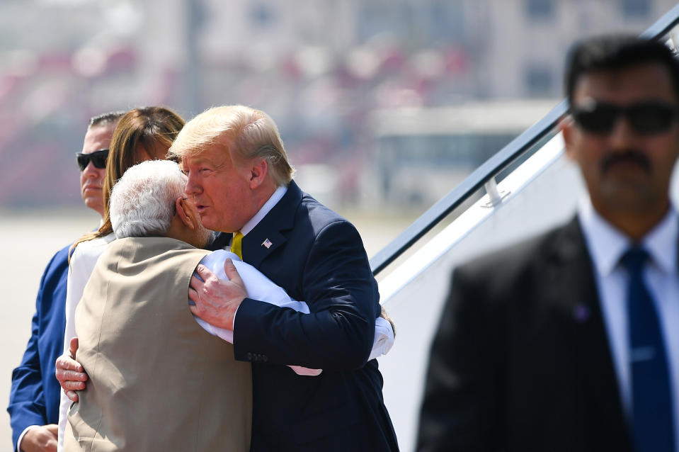 India's Prime Minister Narendra Modi (L) embraces US President Donald Trump upon his arrival at Sardar Vallabhbhai Patel International Airport in Ahmedabad on February 24, 2020. (Photo by Mandel NGAN / AFP) (Photo by MANDEL NGAN/AFP via Getty Images)