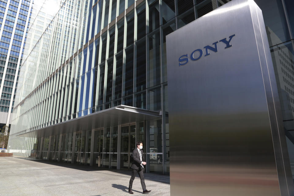 A man walks past the headquarters of Sony Corp. in Tokyo, Wednesday, Feb. 3, 2021. Sony Corp. reports its fiscal third quarter profit jumped 62%, positioning the Japanese entertainment and electronics giant for a record annual profit as its bottom line got a healthy boost from its mega-hit animation film “Demon Slayer.” (AP Photo/Koji Sasahara)