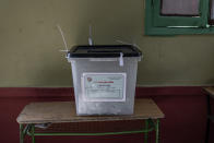 A ballot box is seen on the first day of the parliamentary election inside a polling station in Giza, Egypt, Saturday, Oct. 24, 2020. Egyptians began voting Saturday in the first stage of a parliamentary election, a vote that is highly likely to produce a toothless House of Representatives packed with supporters of President Abdel-Fattah el-Sissi. (AP Photo/Nariman El-Mofty)