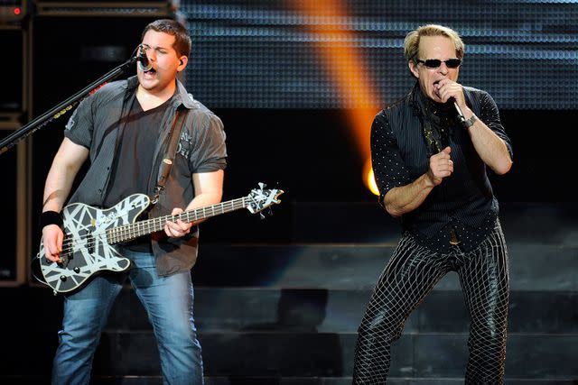 <p>David Becker/Getty</p> Wolfgang Van Halen and David Lee Roth performing in Las Vegas in May 2012