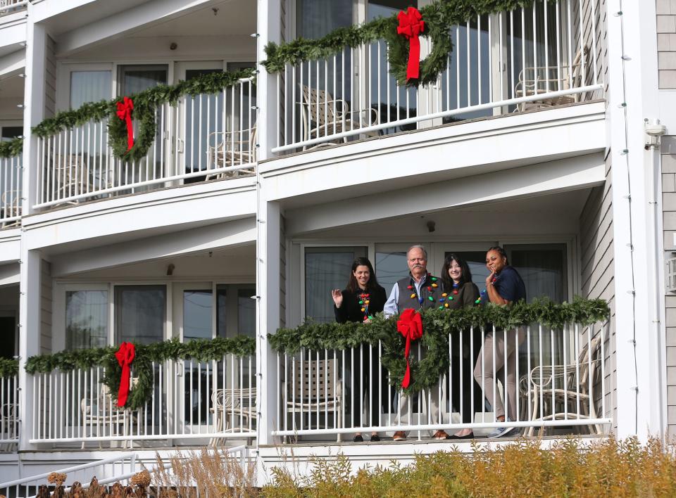 The Anchorage Inn in York joins the Festival of Lights with a fireworks show at Long Sands beach and a visit from Santa Claus on Saturday, Nov. 25. From left: Caitlynn Ramsey, her father Ray Ramsey, Margaret Carcaterra and Novi Mullings.