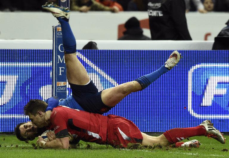 Wales's Dan Biggar scores a try during the Six Nations match against France on February 28, 2015 at the Stade de France