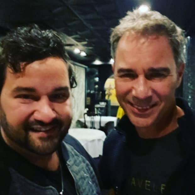 Andrew Perry, left, got to meet his hero, actor Eric McCormack, during a visit to St. John's last week.  (Submitted by Andrew Perry - image credit)